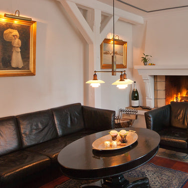 PH 2/1 stem fitting chandelier in situ living room 