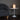 pink handle glass table lamp in midcentury room lit up