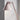 Pink table lamp against a light gray wall