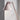 Pink table lamp against a light gray wall