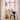 Modern interior with a black chair, decorative items, and pendant lights in a room with large windows. 'Cirque' Pendant Lamp by Clara von Zweigbergk for Louis Poulsen Two enlighten