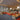 PH 5-4½ pendants installed in Modern cafeteria with tables, chairs, and a counter area.