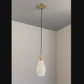 glass and brass midcentury finnish pendant similar to mauri almari or paavo tynell designs in a short video with a grey background