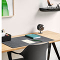 close up of vitra products prouve compas desk and night clock and black corniche shelf