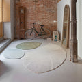 quill rugs with bicycle in brick loft