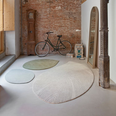 quill rugs with bicycle in brick loft