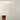 Lamp with a pleated white shade on a gray background