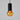 Pendant light with black cylindrical fixture and amber glass bulb on a gray background