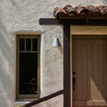 ZUZU Silver Painted wall sconce on spanish style entry way