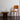 standard chair with vl56 pendant and tynell glass vase against a white wall