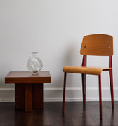 standard chair with vl56 pendant and tynell glass vase against a white wall