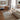 Modern living room with a sofa, rug, and decor elements.