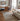 Modern living room with a sofa, rug, and decor elements.