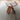 Wooden yanagi vitra stool on a textured rug