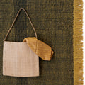 outdoor mustard and black rug with linen bag 