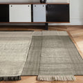 tres pearl rug on a wood floor with charlotte perriand style credenza