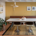 tres texture rug with vitra EM table in a yellow room with sammode wall light