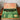 Green and brown box with 'Jeweltone' branding on a wooden surface.