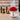 Red dome lamp on a wooden surface with a blurred background