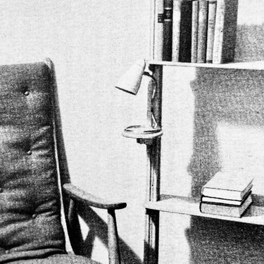 Oluce vintage catalog with vipere lamp on vitsoe style metal shelving