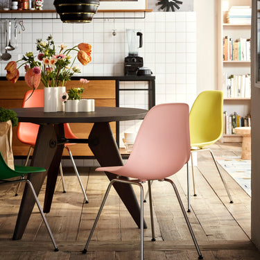 Colorful chairs around a table in a kitchen setting