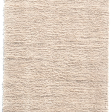 off white wool nanimarquina wellbeing shaggy rug on a white background