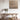 Wooden dining table with a chair in a room with a textured wall and decorative elements.