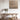 Wooden dining table with a chair in a room with a textured wall and decorative elements.