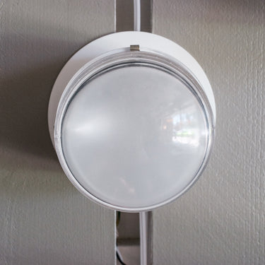 white fresnel wall light oluce front view