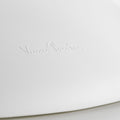 White surface with a subtle embossed logo