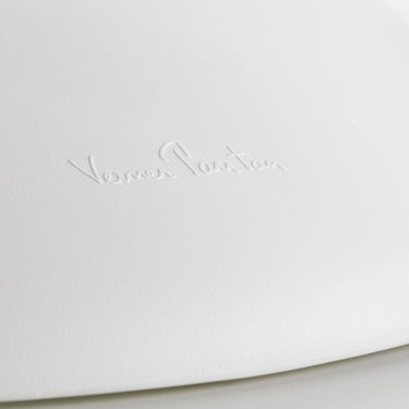 White surface with a subtle embossed logo