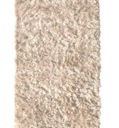 off white wool nanimarquina wellbeing shaggy rug on a white background