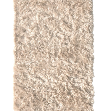 off white wool nanimarquina wellbeing shaggy rug on a white background
