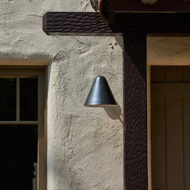 ZUZU STEEL Painted wall sconce at entryway
